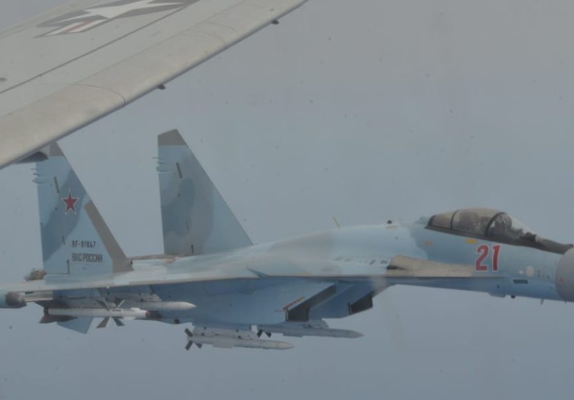 Russian Fighter Jets Buzz U.S. Navy Jet - Video